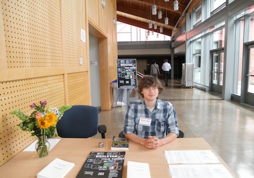 Student worker Nate greets guests.